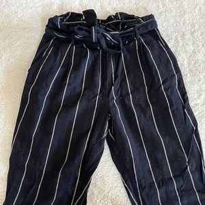 Black & white pin stripe ankle length pants.